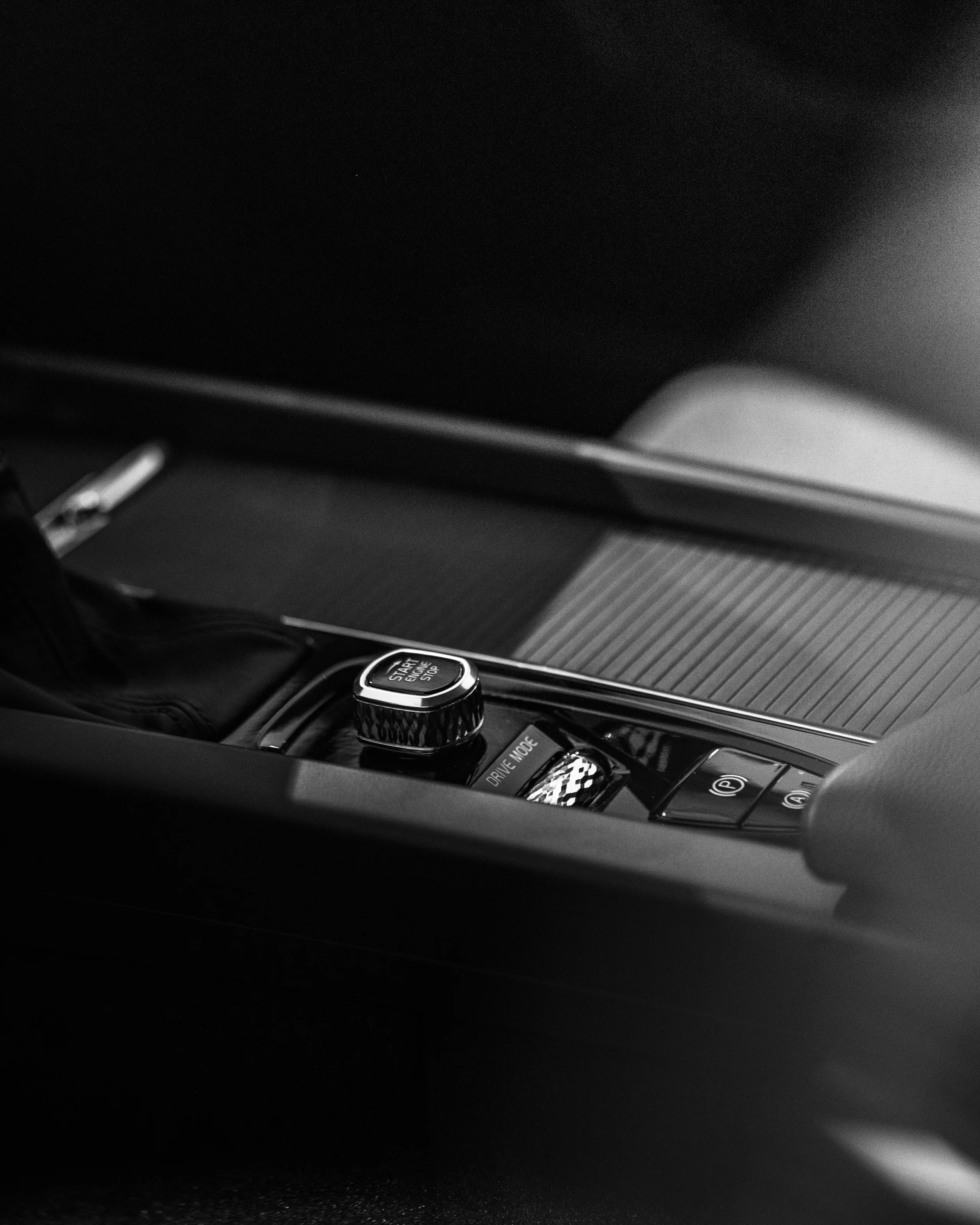 Black and white detail of a car interior and gear selector
